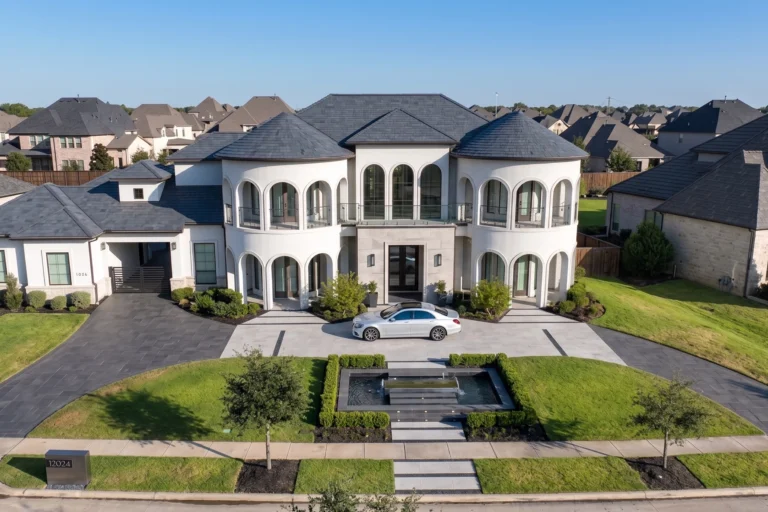Luxury home in Southlake Texas with Mediterranean architecture, grand entrance, arched windows, and modern landscaped front yard in DFW Metroplex